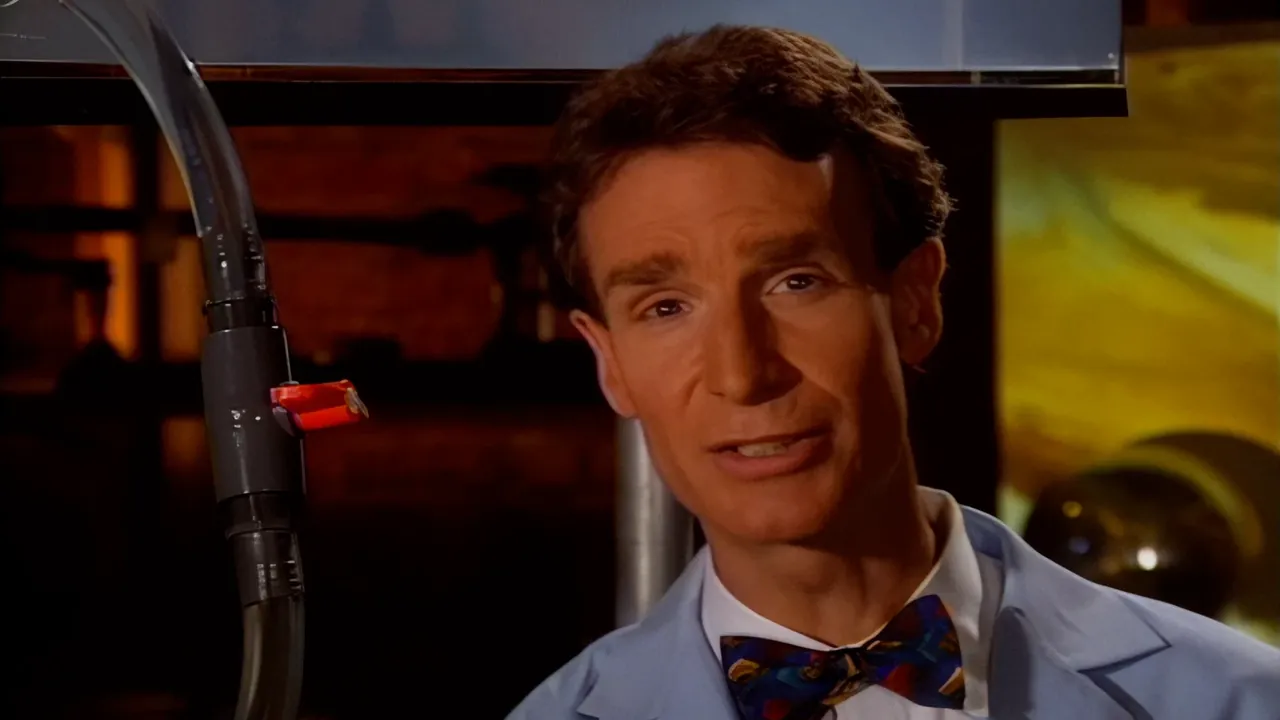 Bill Nye in his lab coat and bow tie, one frame split down the middle: the original broadcast on the left is soft and blurred, the remaster on the right is sharp and clear.