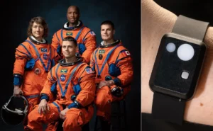A composite image showing circular headshots of the four Artemis II crew members—Victor Glover, Christina Koch, Reid Wiseman, and Jeremy Hansen—on the left. On the right is a clear close-up photograph of a human wrist wearing the actual rugged, black, rectangular ARCHeR biometric device.